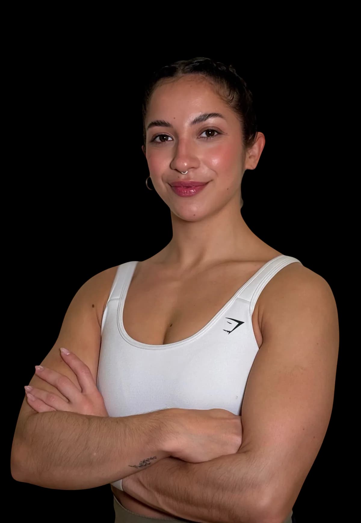 Sara Brigites smiling with her arms crossed